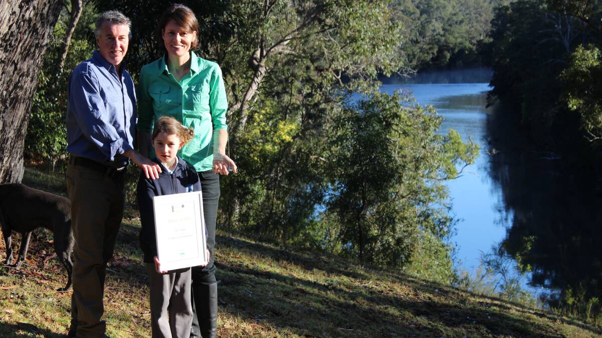 RIVER OF GOLD: Operators of the Escape Luxury Camping at Shallow Crossing Colin and Lucille Bailie, pictured with their daughter Finn, were unable to attend the awards night due to the high level of the water in the Clyde River, but were thrilled to take out the Unique Accommodation category.