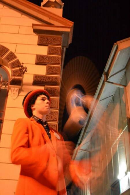 Rhys the Trickster showing off his talent outside the Milton Theatre on Friday night.