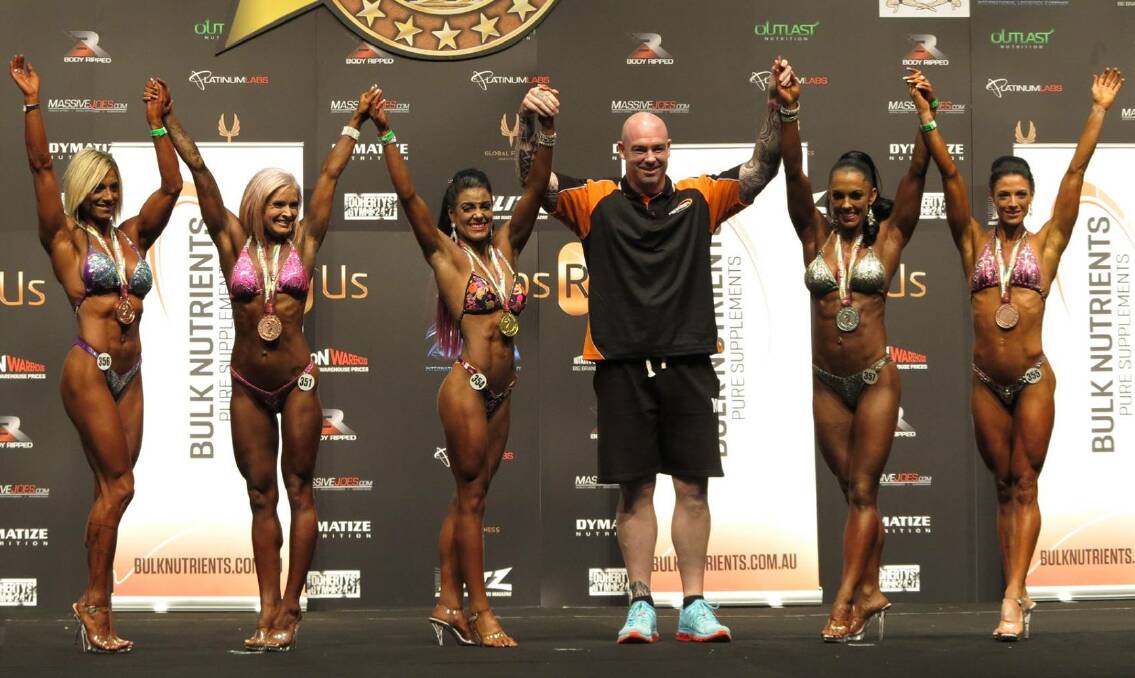 GOLD MEDAL: Rhiannon Keith (centre) with fellow competitors after winning her category in the Arnold Classic Australia bodybuilding competition.