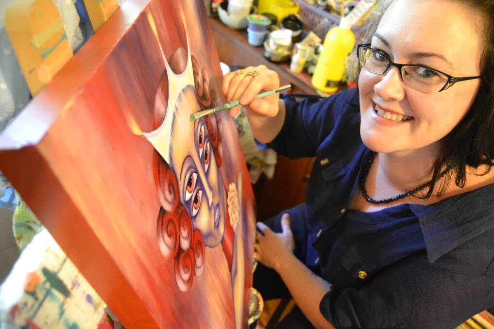 BODY IMAGE: Ulladulla artist Rebecca Boyd working on her Clash-themed works that will be on show at the Greenhouse Gallery in Milton during ArtFest.