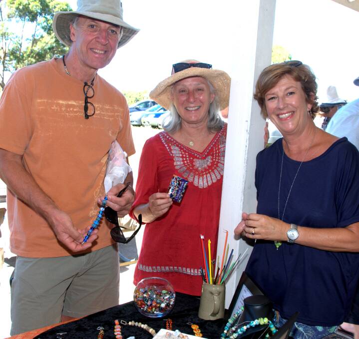 HOME MADE: Peter and Lynn Mussett with Leslie Heriot checking out the Unique Beads stall at the last Bawley Point Market. Photo: LISA HARDWICK