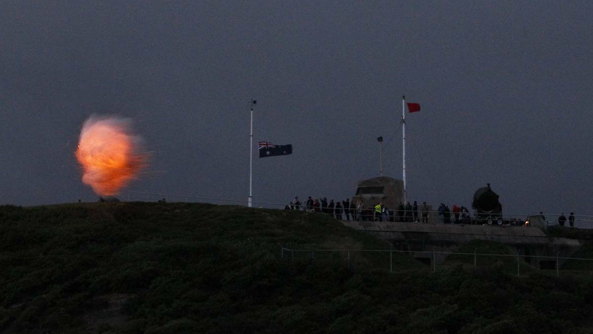 NEWCASTLE: Fort Scratchley cannons fire at the Nobbys beach dawn service. Photo: Jonathan Carroll, The Newcastle Herald.