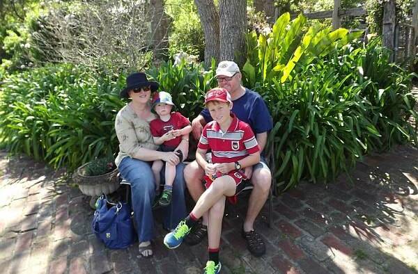 BEAUTIFUL WEATHER: Darren and Jodie Steadman with sons Kyle and Jeremy enjoying the beautiful garden at the Coogans during the open gardens weekend.    
