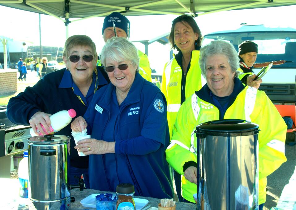 GREAT SUPPORT: Marine Rescue Ulladulla Members Elaine Wilkinson, Frank Van Der Zwet, Di Lambert, Lyn Meehan and Joy Marshall prepare a breakfast barbeque and morning tea for the 2014 MUVCCC Harbour Classic Rally. 