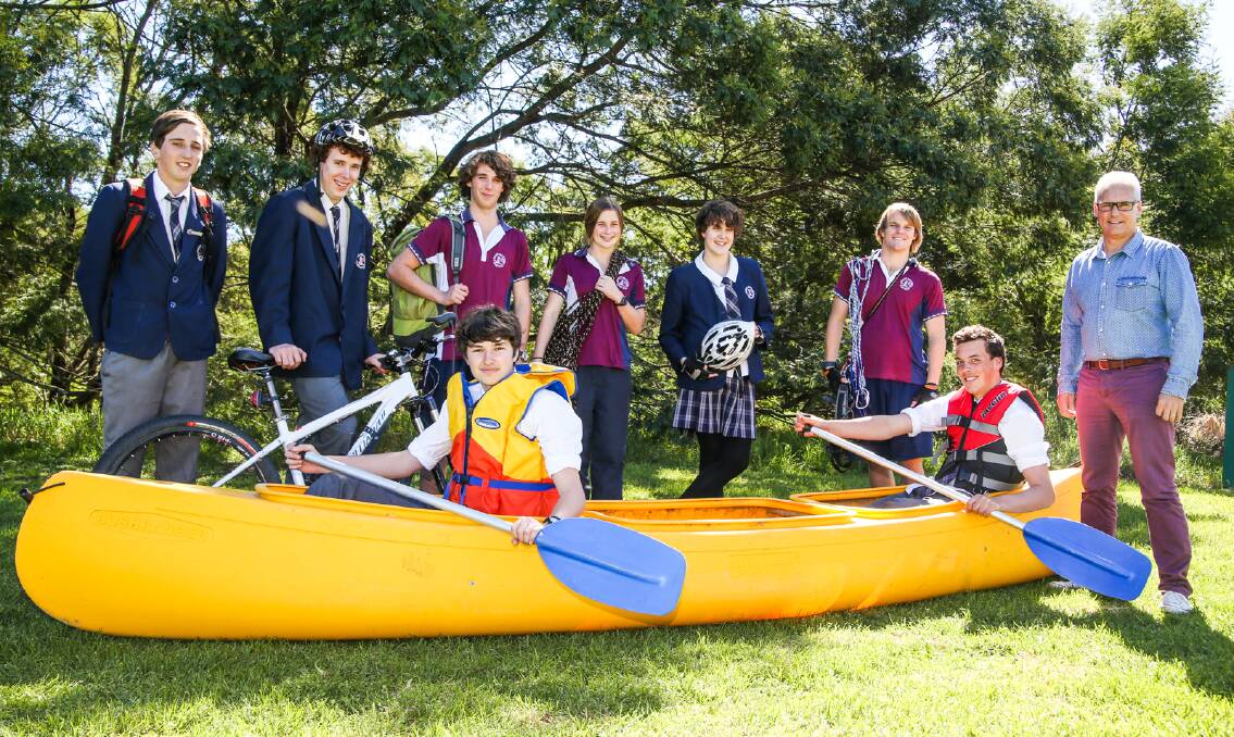 READY TO RACE: The Shoalhaven Anglican School Hillary Challenge Team - standing: Sam Woods, Rohan Kerr, Jacob Monte (support crew), Ruth Potter (reserve), Alicia Congram, James Baccarini and sponsor Craig Cameron. Sitting in the canoe are Pat Devlin and Charlie Guerit. Absent: Lauren Hemsworth, Anna Smith. 