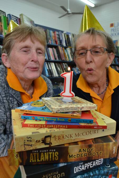 TIME TO CELEBRATE: Ulladulla-Milton Lions Pre-loved Bookstore volunteers Jayne Langdon and Colleen Green celebrate the store’s first birthday following a highly successful year. 