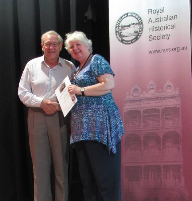 AWARDED: Dennis Goodland is presented with his grant award from the Royal Australian Historical Society president Carol Liston. 
