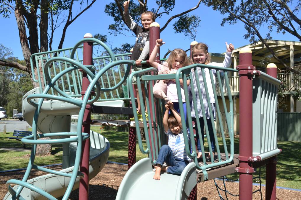 OUT WITH THE OLD: Shoalhaven City Council will inject $100,000 into a new, larger playground at Narrawallee Inlet, much to the delight of youngsters Kai and Eve Snyders, Molly Kent and Kodi Upson, pictured on the old equipment. 