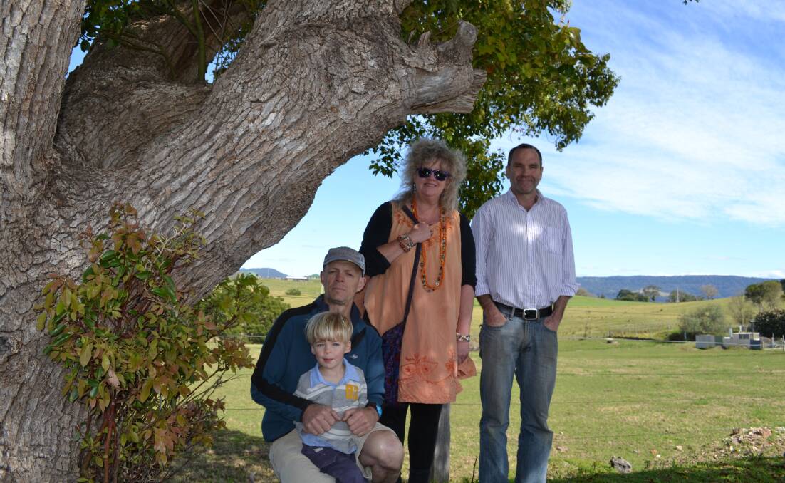 MEMORIAL: Milton Promotions Inc member Louise Allen, MPI president Andrew Mathers and arborist Patrick Faulconer, with his son William, admire one of the five remaining trees planted in Milton’s Avenue of Honour in 1926.  