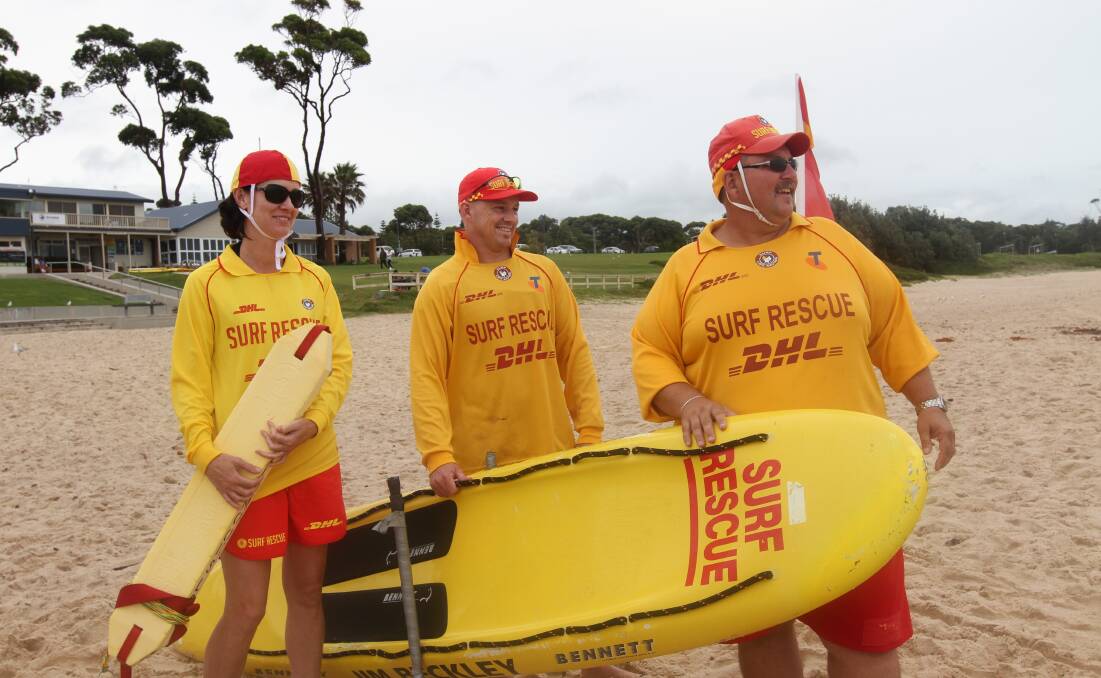 ON PATROL: Life savers Jodie and Scott Laing with Mollymook Surf Club captain Scotty Graham. 