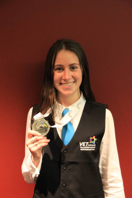 BUSINESS BRAINS: Ulladulla High School’s Renae Anderson shows off her silver medal she won at the National WorldSkills Business Services competition in the Vocational Education and Training (VET) schools category. 