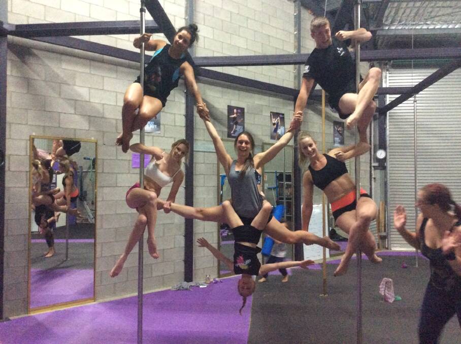 TRICKY: Advanced students Marie Hibberd, Hayley Machon (Left pole top to bottom) Sam Haramis, Brodie McCluskey (middle pole top to bottom), Xavier Lake, Emily Clemson (right pole top to bottom) trying out some new partnered moves while Sarah Ryan (right) makes sure no one falls. 