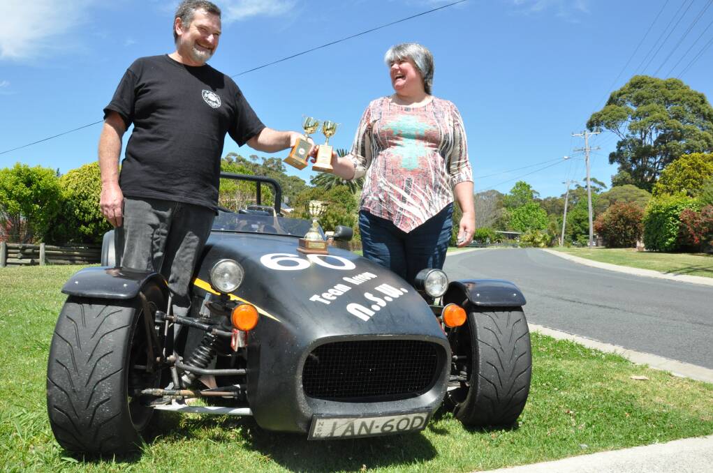DRIVE AWAY: Faye and Ian Diven show off their national trophies in their Clubman sports car.
 