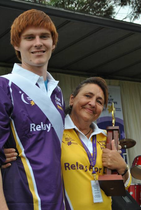SHOW OF STRENGTH: Luke McKinnon presented an emotional Lani Fisher with the Heidi Brook Memorial Award in memory of his mother during last year’s Relay for Life. 