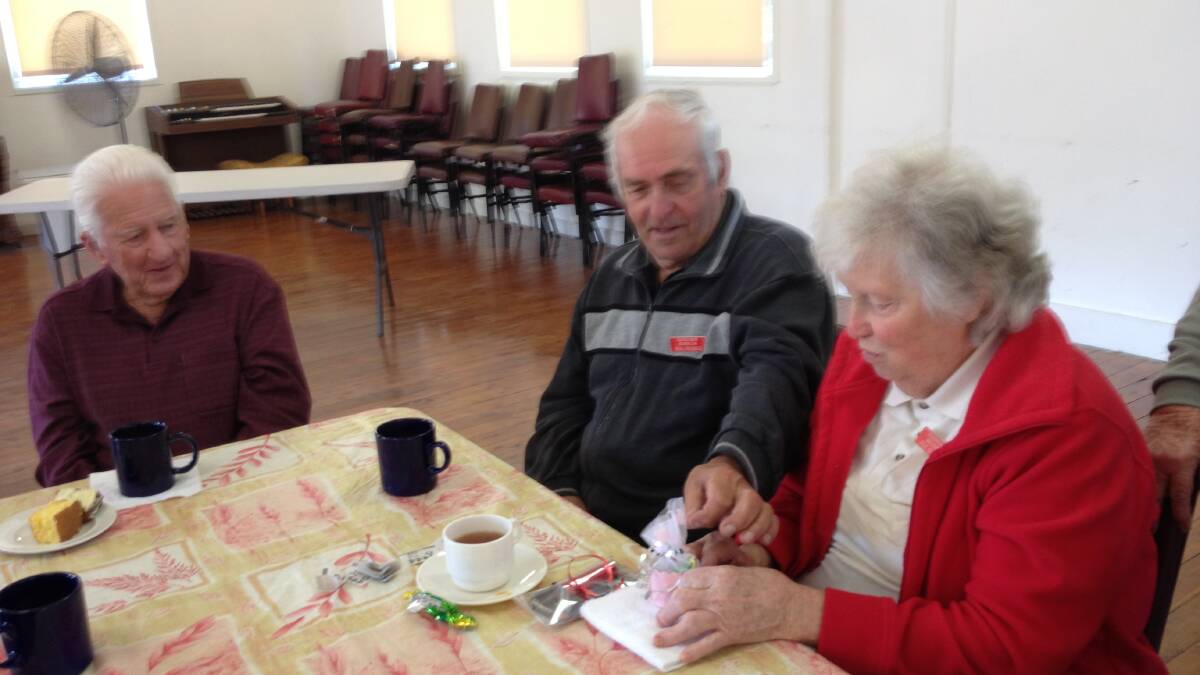 GIFT TIME: Members of the Ulladulla Stroke Recovery Club make presents at the last meeting. 