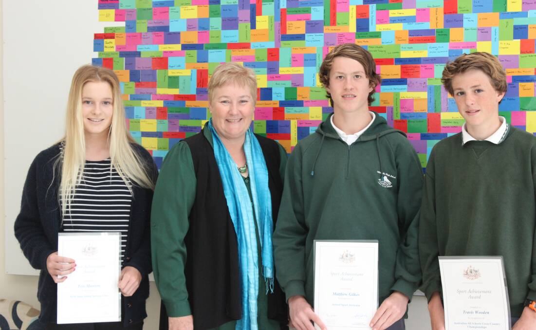 SPORTS STARS: Surfer Tess Mawson, federal member for Gilmore Ann Sudmalis, cricket star Matthew Gilkes and cross country runner Travis Wooden celebrate the Local Sporting Champion grants at the Dunn Lewis Centre last week.  