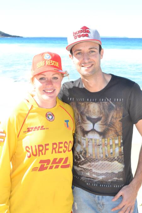 THANKS: Mollymook Surf Life Saving Club member Danielle McKenzie is thanked by Peter Miller after she found his white gold wedding ring in the sand on Saturday. 