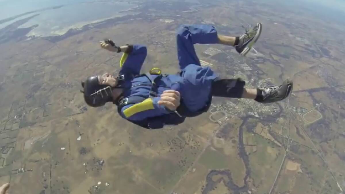 A screenshot from a video which shows how a WA skydiving instructor was forced to save a man who had a mid-jump seizure. Photo: Nomadic Adrenaline/Youtube. 