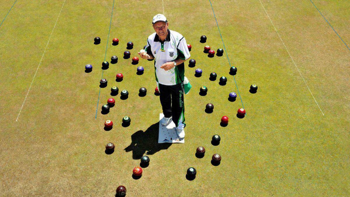 ON THE GREEN: Frank Peniguel visited three local bowling clubs on Sunday as part of a world record attempt.