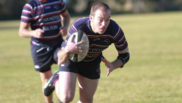 Milton Platypi player Mike Phippard goes over to score the opening try in the clash against Broulee. 
