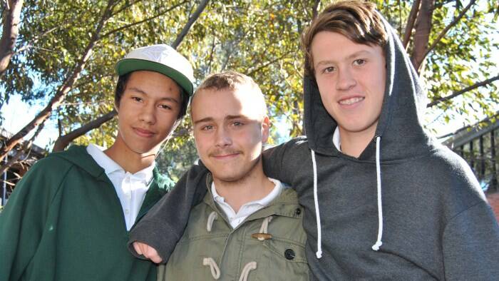HITTING THE BOOKS: Kiarn Roughley (centre), with his school mates Daniel Chappell and Matthew Gilkes, is happy that life is getting back to normal after spending almost nine months in hospital.