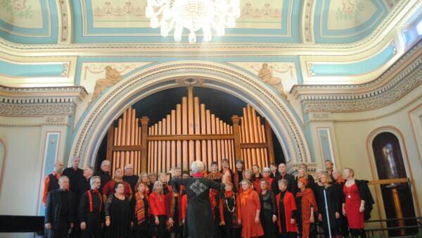 Glorious MUDSingers warm up before their performance in the 1866 grandeur of Hobart Town Hall. Photo by HAMISH RICHARDSON. 