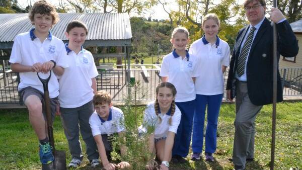 Pictured helping to plant the tree on Monday were school prefects Angus Rutherford and Declan Davies, captains Jack Skinner and Jade Mudge, prefects Aimee Clugston and Yasmin Davidson, and school principal Mark Thomson.