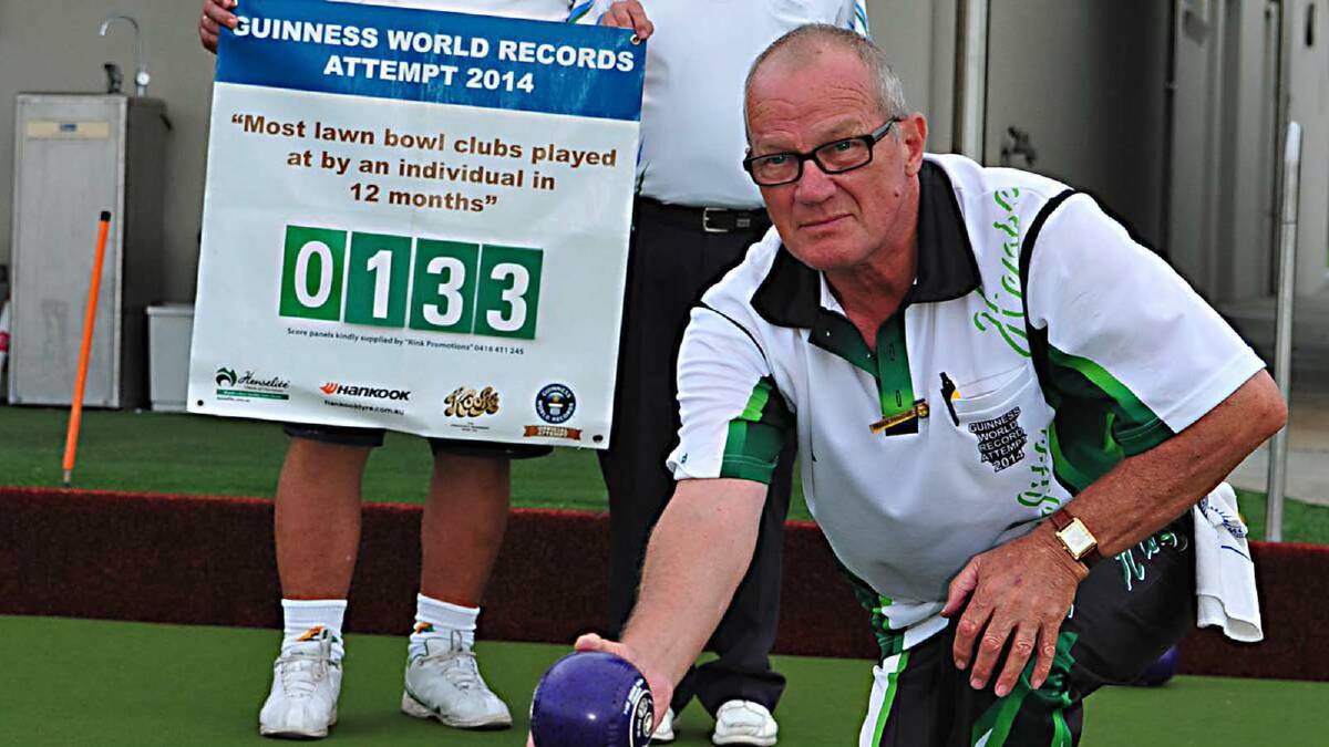 ON THE GREEN: Frank Peniguel visited three local bowling clubs on Sunday as part of a world record attempt.