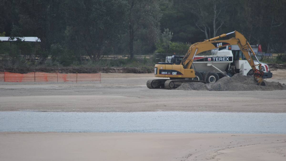 Sand is being moved from the Burrill Lake entrance to create a public beach east of the Dolphin Point Tourist Park.