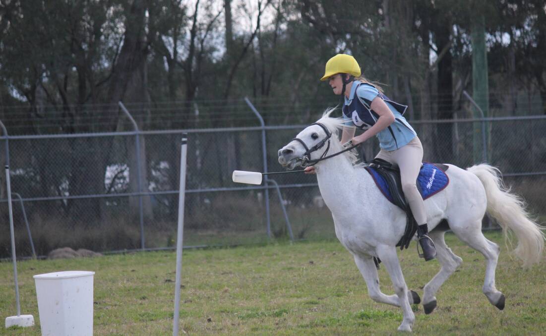 IN THE SADDLE: Charlotte Millard riding for a spot in the NSW Mounted Games team. 