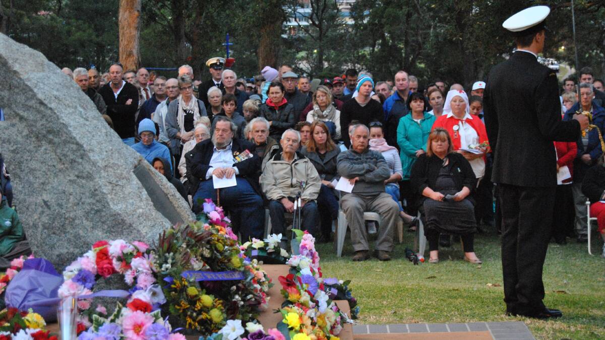 A big crowd gathered at Kendall Cottage in Ulladulla for the Anzac Day dawn service.