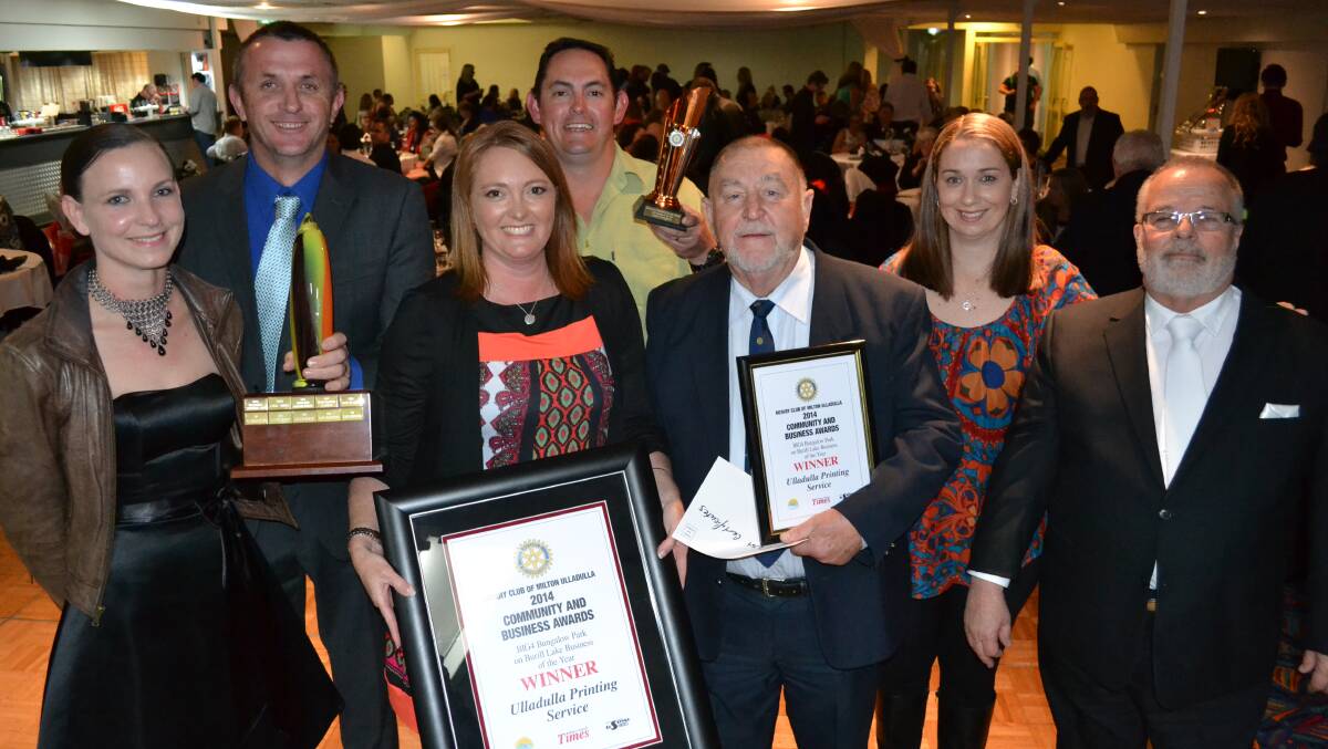 Ulladulla Printing Service staff Danielle McCauley, William Drury, Gillian Drury, Adam Gumley, Ted Wild and Karina Gumley accept their business of the year award of Friday night from Steve Clarke of BIG4 Bungalow Park on Burrill Lake.