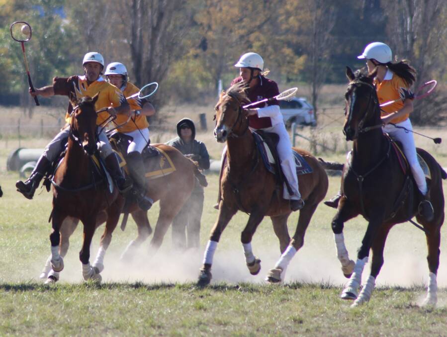 Leon Murray takes the ball up the field against Bungendore, with fellow Milton Ulladulla Polocrosse Club players Toni Murray and Sally Herne in support. Photo by Teagan Wilford.