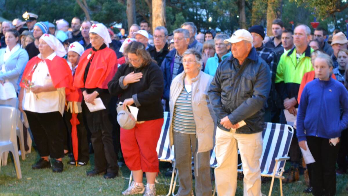 A big crowd gathered at Kendall Cottage in Ulladulla for the Anzac Day dawn service.