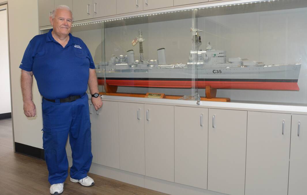 REPLICA REMINDER: Family of the late Tom Lees donated his model of HMS Belfast to commander Ken Lambert (pictured) and his volunteers at the new Ulladulla Marine Rescue base. 
