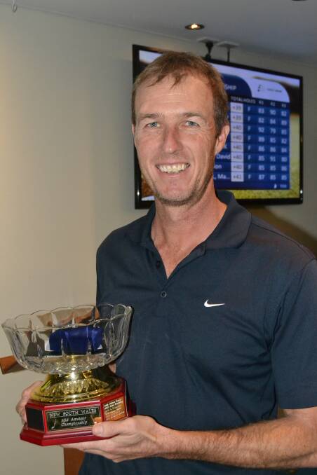 WINNER:  Scratch winner at the 2015 Mid-Amateur Championships, Andrew Tharle from the Royal Canberra Golf Club, accepts his trophy after praising the volunteers for the event that attracted 100 men and 40 women entrants.