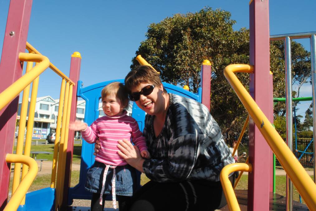 PLAYTIME: Neridia Whitehorne with her daughter Hadley, playing on the current park equipment at Mollymook Beach Reserve. 