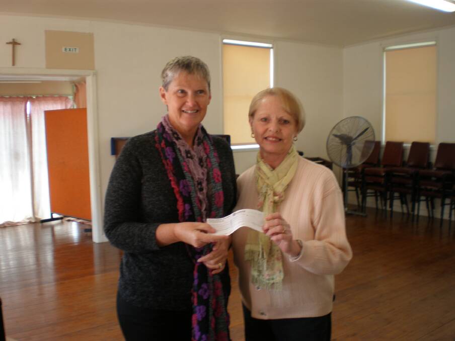 FUNDING BOOST: Christine Grimaldi, on behalf of the Milton Ulladulla Uniting Church, presenting cheque to Alison Easton, coordinator of the local Parkinson’s Support Group.