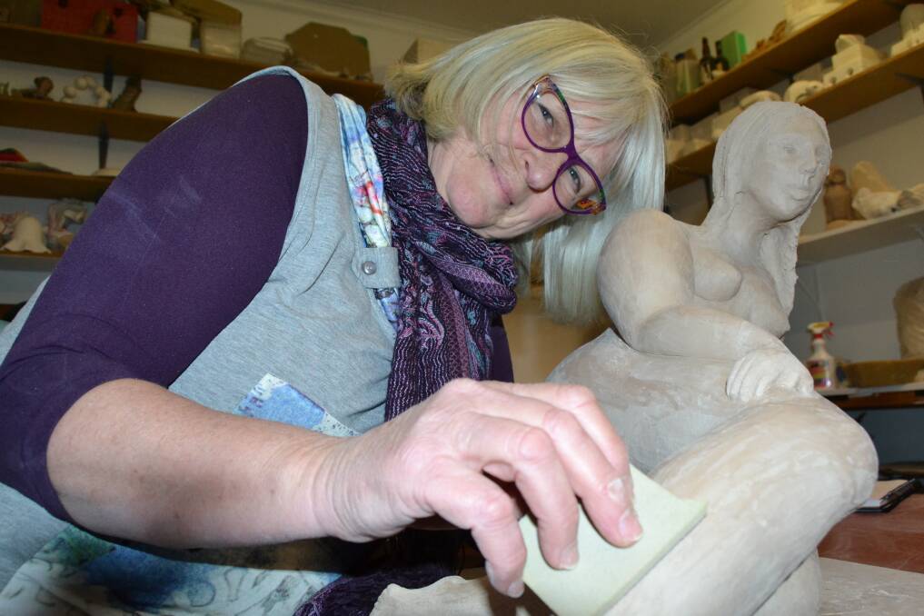 WOMANLY: Nadja Burke works on one of her human form pieces in the lead up to ARTfest. 