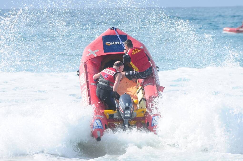 FLOOR IT: Mollymook Surf Club members training for their IRB qualifications, punch through the swells last weekend.  Photo: Therese Spillane.