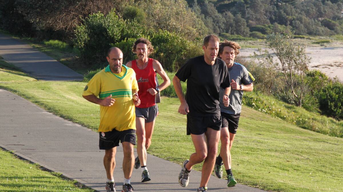 ON THE RUN: Paul McDonald, Martin Tomasini, Steve Grant and Anders Auer lead the pack along Mollymook Beach during last week’s Anzac Day Run.
