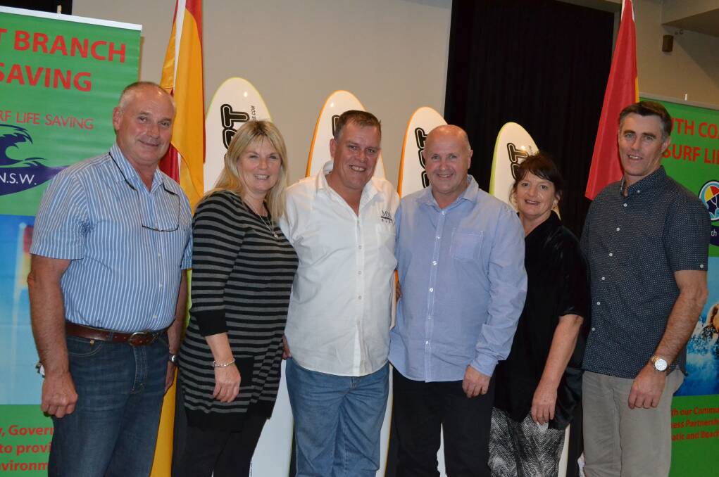 CHEERING: Mollymook Surf Life Saving Club members and award winners Bruce O’Sullivan, Sue Whitford, Adam Woodward, Anthony and Di Austin and Kevin Whitford celebrate at Saturday night’s South Coast Branch Surf Life Saving Annual Awards at the Shoalhaven Heads Bowling Club.
