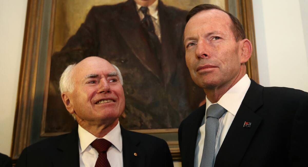 John Howard and Prime Minister Tony Abbott during the opening of "Menzies: By John Howard" exhibition', at Old Parliament House in Canberra in September. Picture: Alex Ellinghausen
