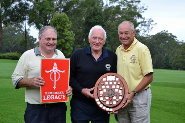 HAPPY WINNERS: Mollymook Golf Club president and veterans golfer Paul Connor presents the legacy shield to winners Laurie Hayes and Harvey Wootton.