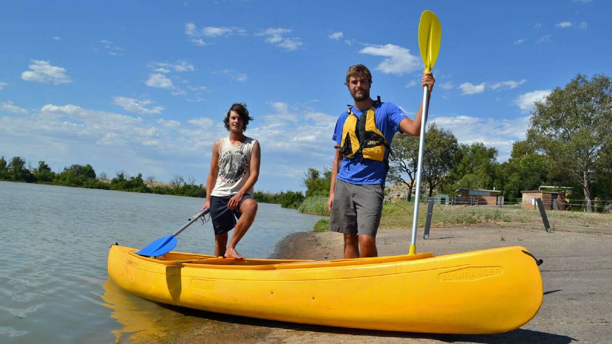 CANOEING: James Knight and John Miller pictured during a break in their paddling journey in Murray Bridge, South Australia.