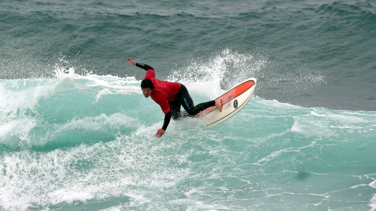 SURF’S UP: The surf was definitely up for the Mollymook Longboarders Charity Classic held on Saturday and Sunday at Mollymook’s Golf Course Reef with Ray Lawrence putting in a great performance to win the Over 38 and the Over 48 divisions. PHOTO: Therese Spillane.