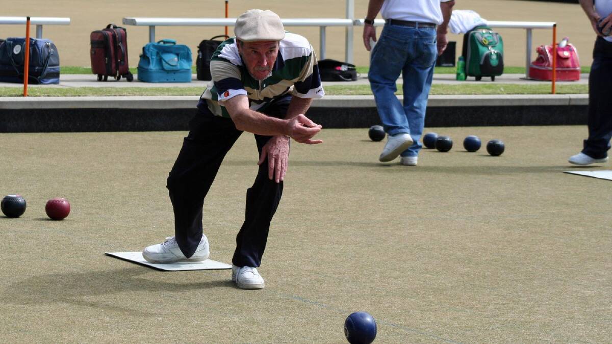 SEND IT DOWN: Ray Fuller bowling at Milton Ulladulla Bowling Club. Photo: LISA GOLDBY.