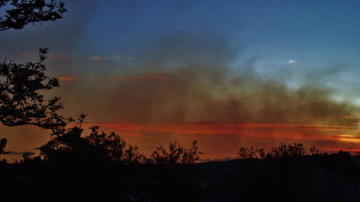 SPECTACULAR: The smoke haze from the fire burning in the Budawang National Park created a spectacular sight in Milton at sunset, with this image captured on Thursday night by Dannie and Matt Connolly.