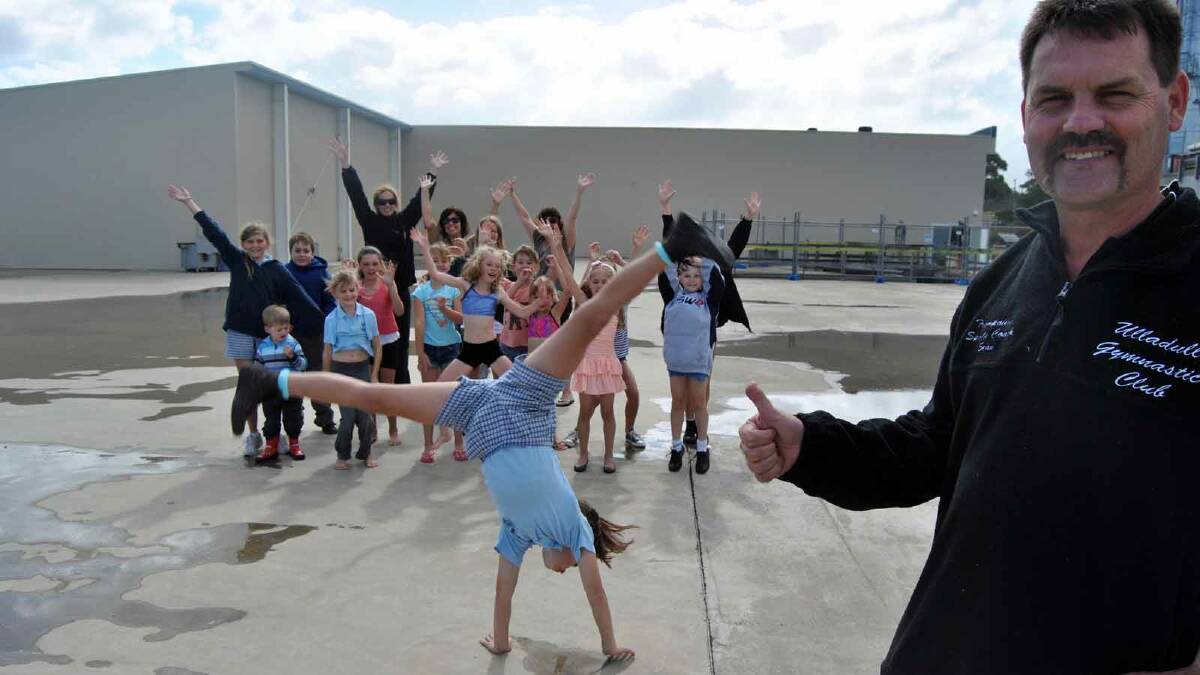 IN A SPIN: Ulladulla gymnastics coach Sean Hendry, gymnast Ella Conlon and club members are pleased to see the wheels turning on the next stage of the Dunn Lewis Centre which will include space for the establishment of a new gymnastics complex.