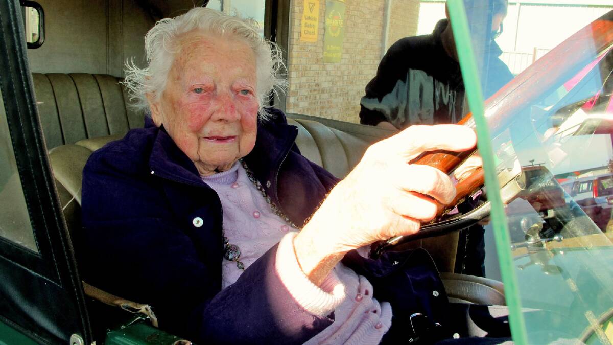 AT THE WHEEL: At 101 Maisie Evans gets behind the wheel of a 1928 Chevrolet almost identical to the one in which she learnt to drive as a 17-year-old.